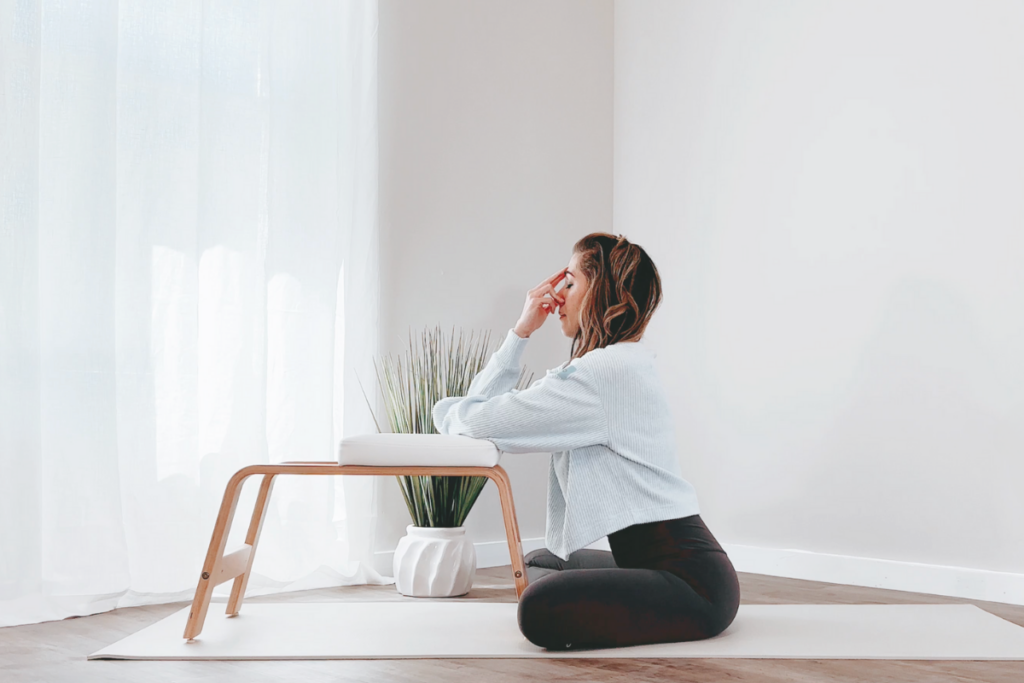 Use a table or chair to support your arm while practicing nadi shodhana (alternate nostril breathing) or other pranayamas